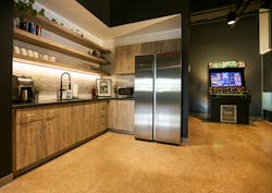 A former lab was removed and the space was reactivated into a galley-style break area featuring a “Rick and Morty” themed arcade machine. A former lab was removed and the space was reactivated into a galley-style break area featuring a “Rick and Morty” themed arcade machine.