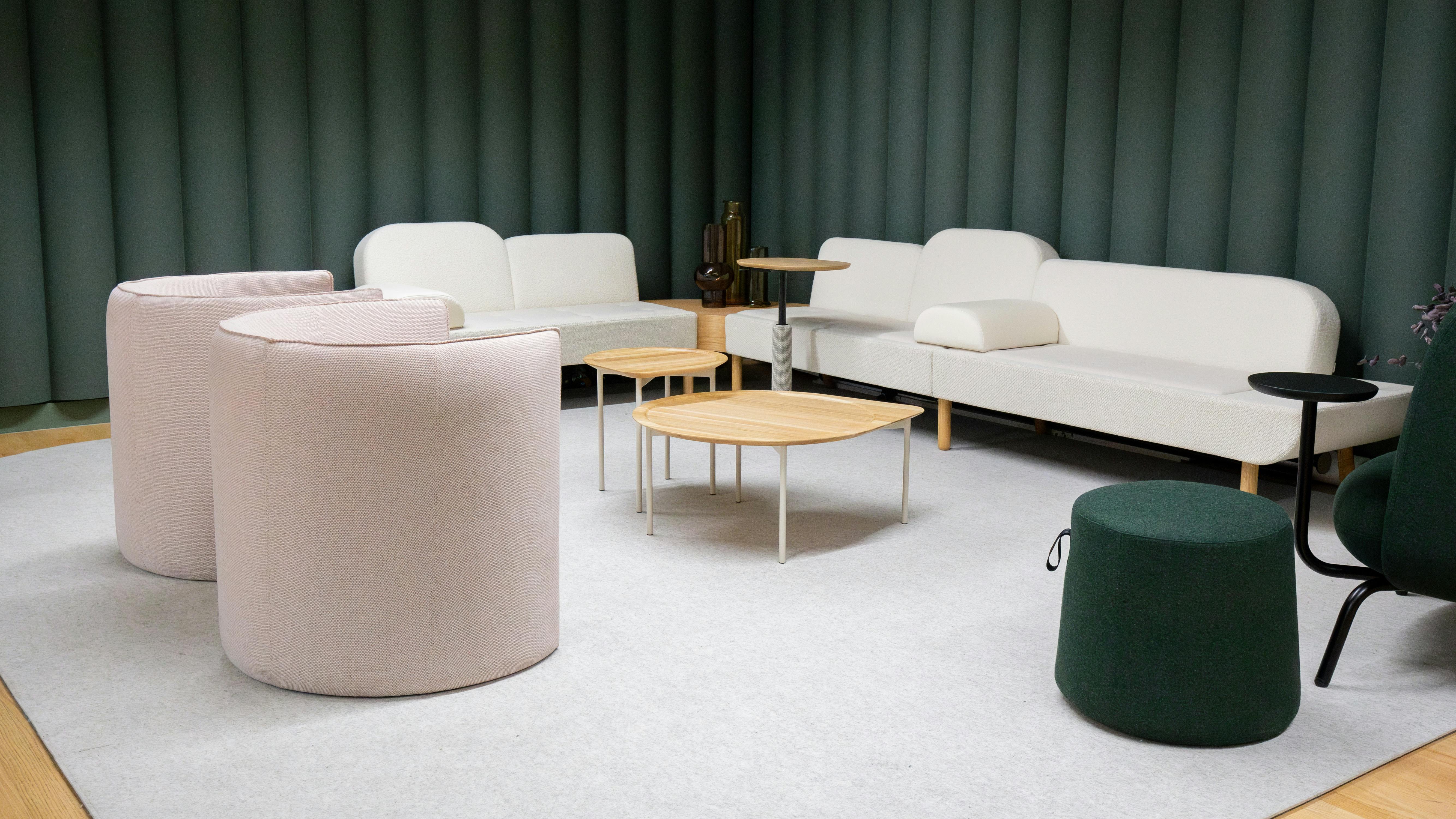 Vignette in new Nomad Collab showroom in NYC featuring soft lounge seating, carpet, and acoustical walls.