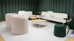 Vignette in new Nomad Collab showroom in NYC featuring soft lounge seating, carpet, and acoustical walls.