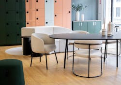 Contemporary lounge seating, table and storage on wood floor in furniture showroom. Contemporary lounge seating, table and storage on wood floor in furniture showroom.