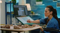 Interior designer drafting a concept layout Interior designer drafting a concept layout