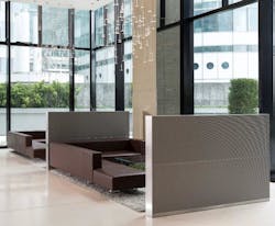 Contemporary lounge seating area with woven metal fabric privacy walls with large windows in background. Contemporary lounge seating area with woven metal fabric privacy walls with large windows in background.