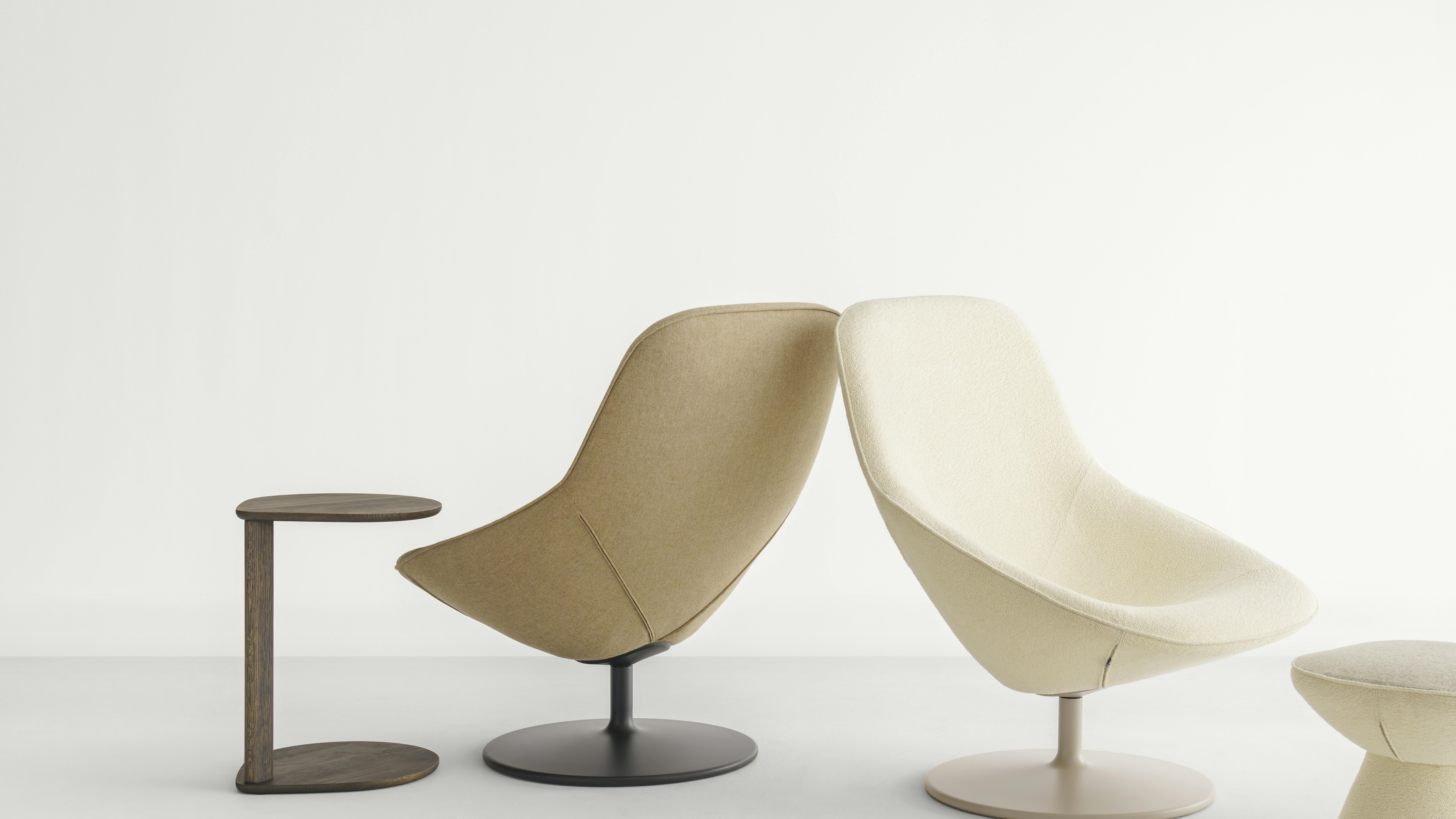 The Pala is a fully upholstered lounge chair on a pedestal base. It is now available in a disc base.