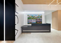 HGA's reception desk features the company's name displayed in high contrast on the wall and a curated art piece behind the desk, depicting the firm's connection to Washington, D.C. HGA's reception desk features the company's name displayed in high contrast on the wall and a curated art piece behind the desk, depicting the firm's connection to Washington, D.C.