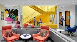 Perkins&Will Interior Design at Family Tree Clinic shows a brightly accented waiting area with grounding neutrals and a vibrant yellow stairwell. Perkins&Will Interior Design at Family Tree Clinic shows a brightly accented waiting area with grounding neutrals and a vibrant yellow stairwell.