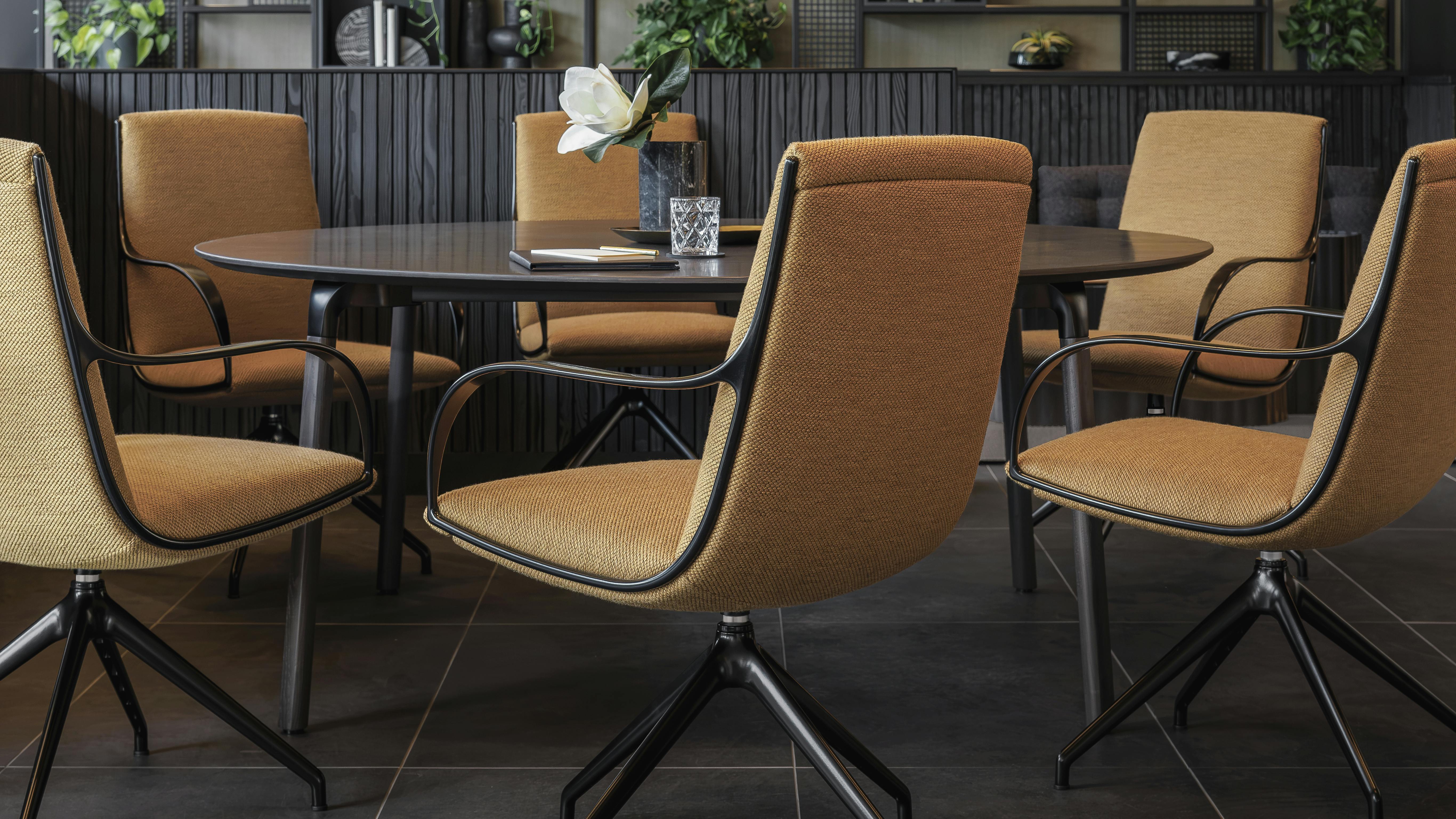 Jotta office chairs situated around a table.