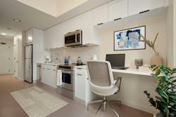 Midland Lofts micro units utilize multi-purpose furniture such as the kitchen countertop workspace that serves as a desk. Midland Lofts micro units utilize multi-purpose furniture such as the kitchen countertop workspace that serves as a desk.