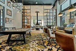 Midland Lofts' clubroom features portraits of classic entertainers, a pool table, and comfortable seating for informal gatherings. Midland Lofts' clubroom features portraits of classic entertainers, a pool table, and comfortable seating for informal gatherings.