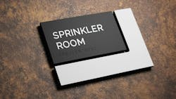 Takeform's Ell sign displaying Sprinkler Room in print and braille. Takeform's Ell sign displaying Sprinkler Room in print and braille.