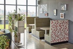 Kimball International Chicago showroom with booths alongside a wall and windows allowing natural light. Kimball International Chicago showroom with booths alongside a wall and windows allowing natural light.