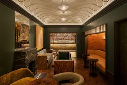 Chez Fifi patrons can enjoy a sophisticated salon that leads to the beautifully sleek upstairs bar. Chez Fifi patrons can enjoy a sophisticated salon that leads to the beautifully sleek upstairs bar.