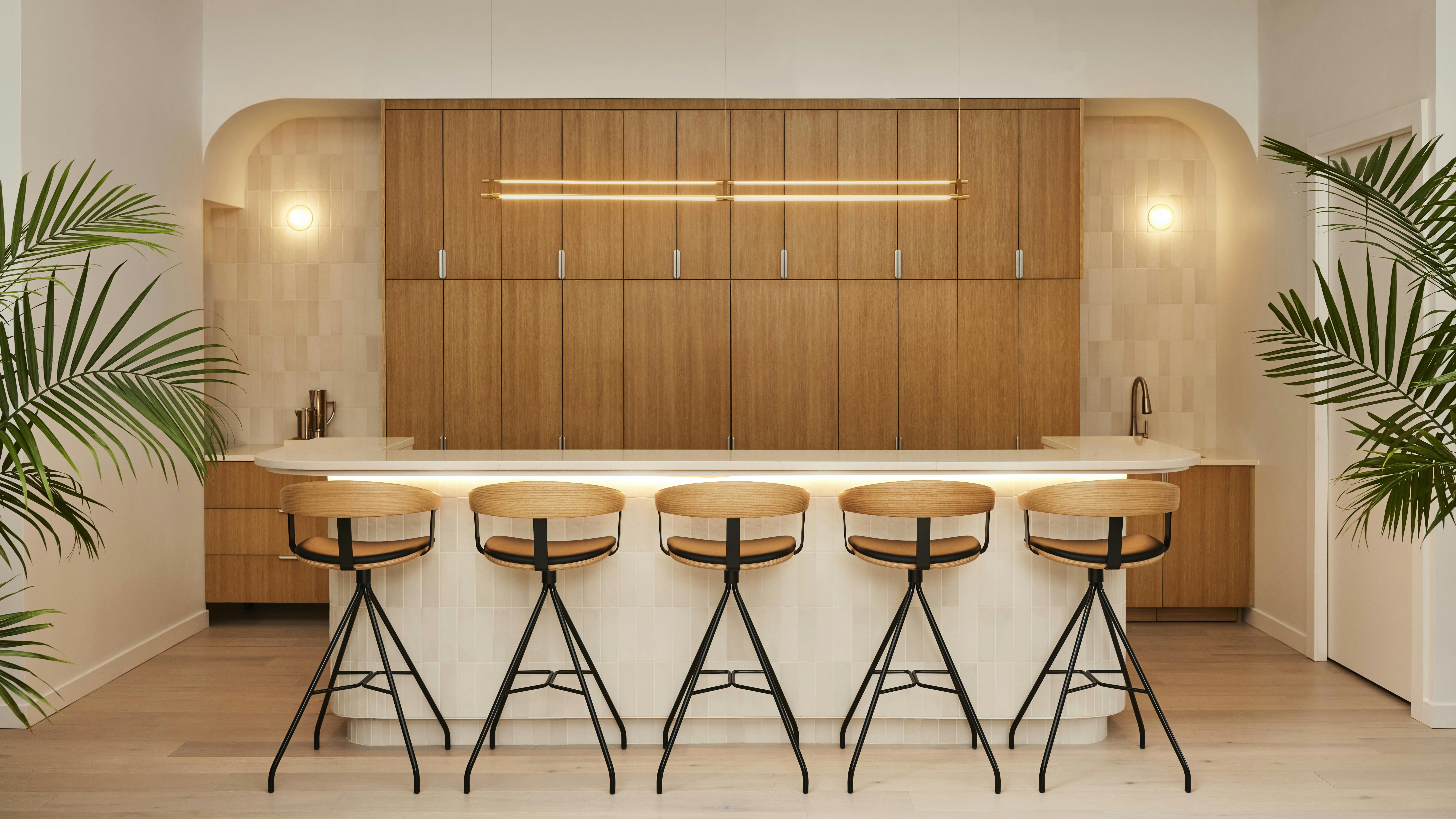 Light wood bar/reception counter at HBF Showroom in New York City, designed by ALA Studio