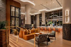 Layered pendant, wall, recessed ceiling, and hidden cove lighting accentuate the glossy sheen of tile surfaces, the glow of burnished metals, and the satin finish of natural woods in the Palato Wine Lounge. Layered pendant, wall, recessed ceiling, and hidden cove lighting accentuate the glossy sheen of tile surfaces, the glow of burnished metals, and the satin finish of natural woods in the Palato Wine Lounge.