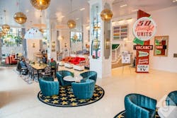 Vibrant lobby of the Graduate Hotel in Nashville with lounge seating, area rugs, and vintage sign. Vibrant lobby of the Graduate Hotel in Nashville with lounge seating, area rugs, and vintage sign.