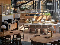 The Living Room open-concept music listening lounge at The Eight with Hi-Fi stereo equipment and wood tables and chairs. The Living Room open-concept music listening lounge at The Eight with Hi-Fi stereo equipment and wood tables and chairs.