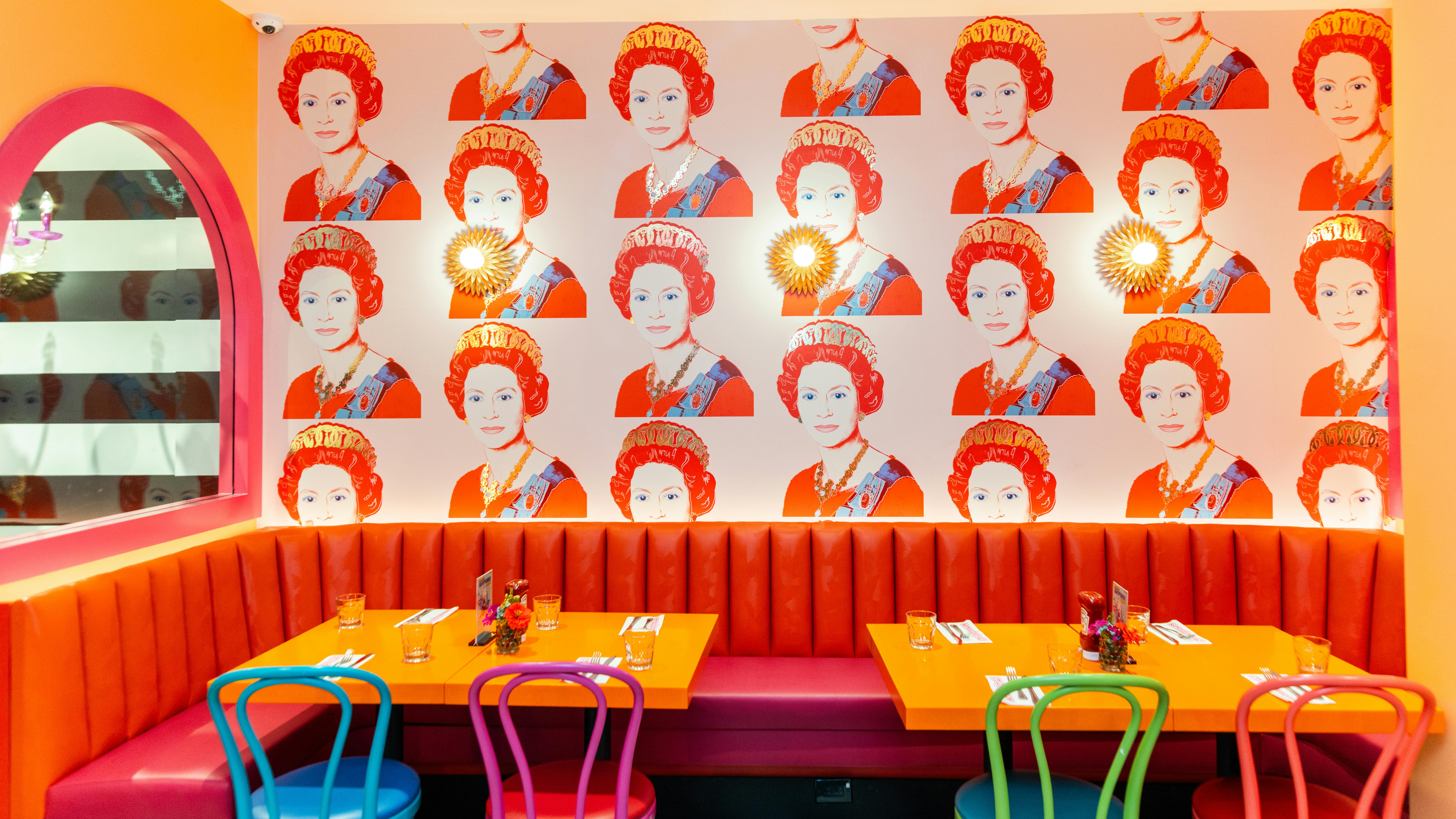 Brightly colored wallpaper of Queen Elizabeth II inspired by artist Andy Warhol.