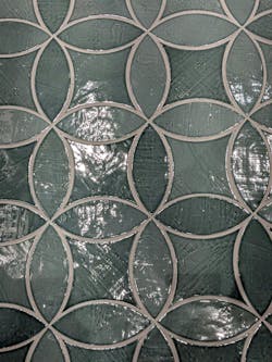 In vibrant, glossy emerald or muted gray-green with purposefully applied depth and shading variation, plenty of tile manufacturers showed a Mediterranean flair. Shown: Cevica’s “Night Fever” club exhibit (large, above) and Natucer Colonial Kite and Petal (inset, left). In vibrant, glossy emerald or muted gray-green with purposefully applied depth and shading variation, plenty of tile manufacturers showed a Mediterranean flair. Shown: Cevica’s “Night Fever” club exhibit (large, above) and Natucer Colonial Kite and Petal (inset, left).