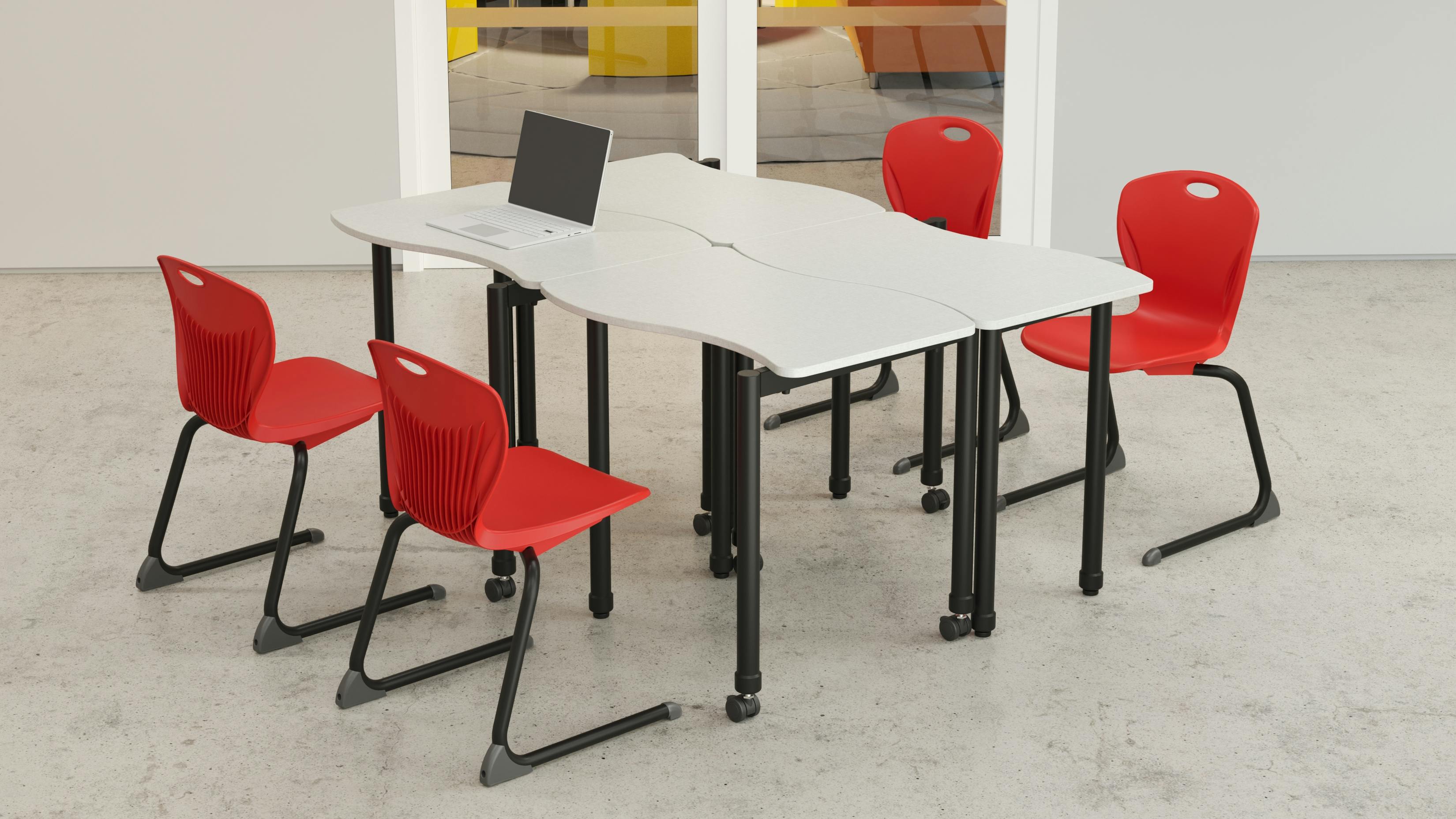 Artcobell Fully Welded Stacking Desks are stackable up to four high, shown with chairs.