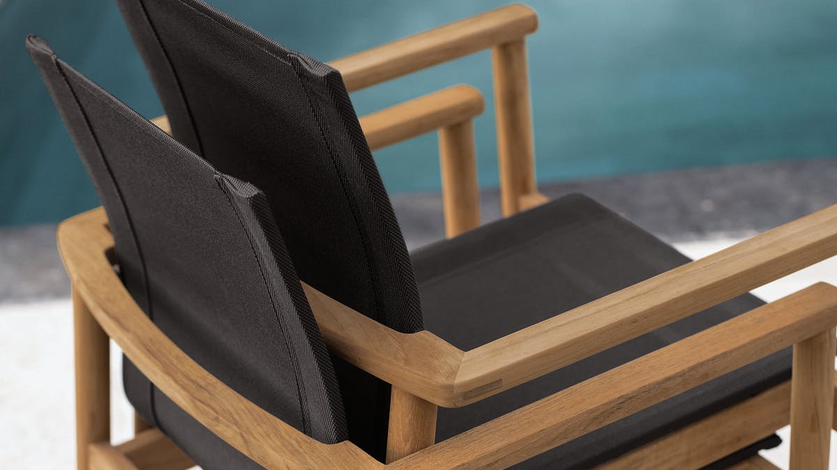 Peri chairs nested together for easy storage.