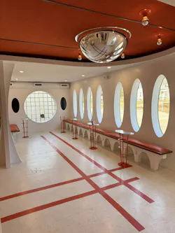 A mix of lines, curves, and geometric shapes in the interior furnishings at Panoramica is complemented by the simple yet bold red patterns, hand-cut by designer Ricky TeeVee, in VCT. A mix of lines, curves, and geometric shapes in the interior furnishings at Panoramica is complemented by the simple yet bold red patterns, hand-cut by designer Ricky TeeVee, in VCT.