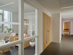 On the residential floors, welcoming lounges create a more intimate space for community connection. Positioned near laundry facilities, these areas feature glass walls that encourage interaction among residents while allowing natural light to filter into the hallway. On the residential floors, welcoming lounges create a more intimate space for community connection. Positioned near laundry facilities, these areas feature glass walls that encourage interaction among residents while allowing natural light to filter into the hallway.