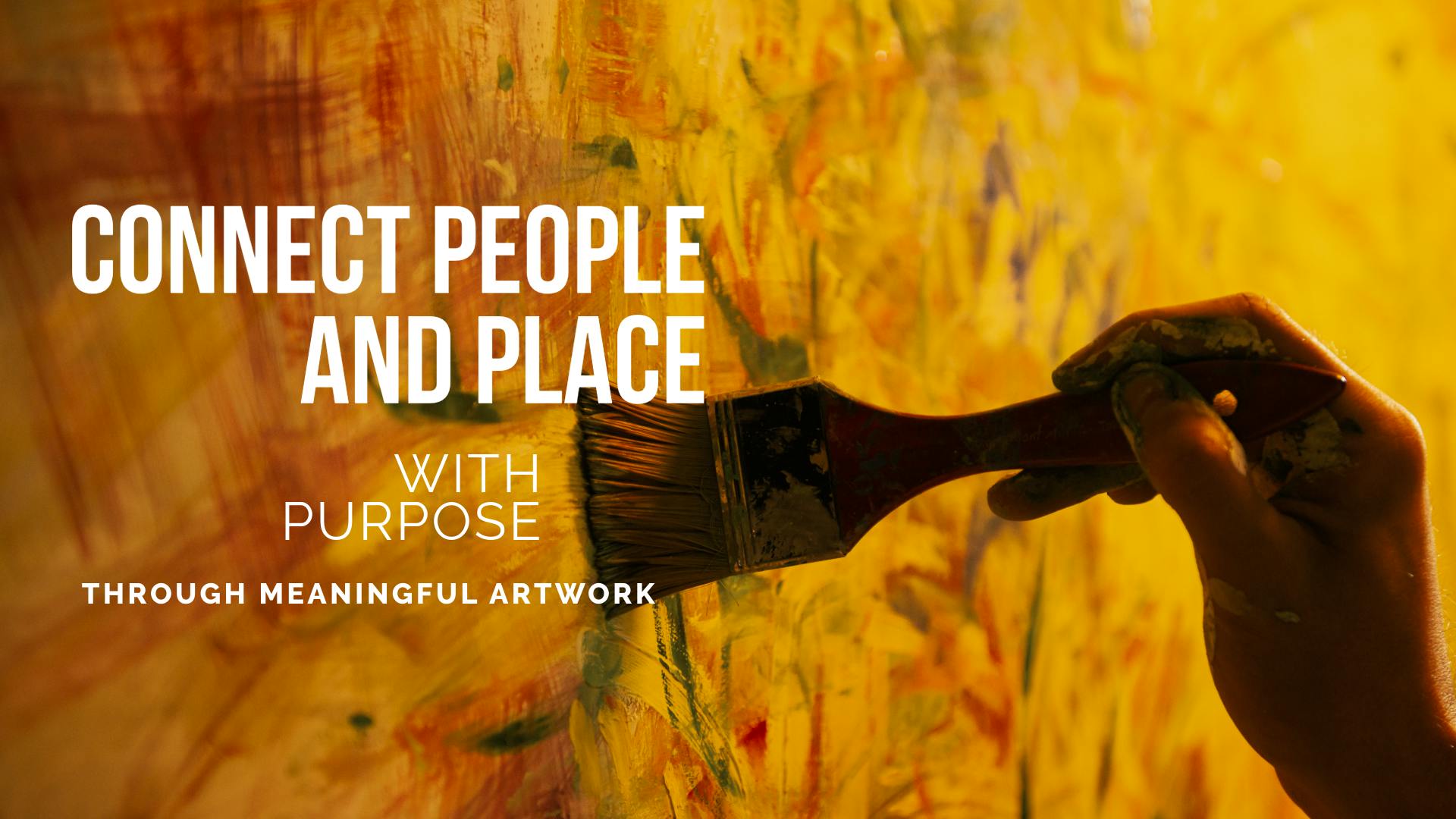 hand painting a mural on wall