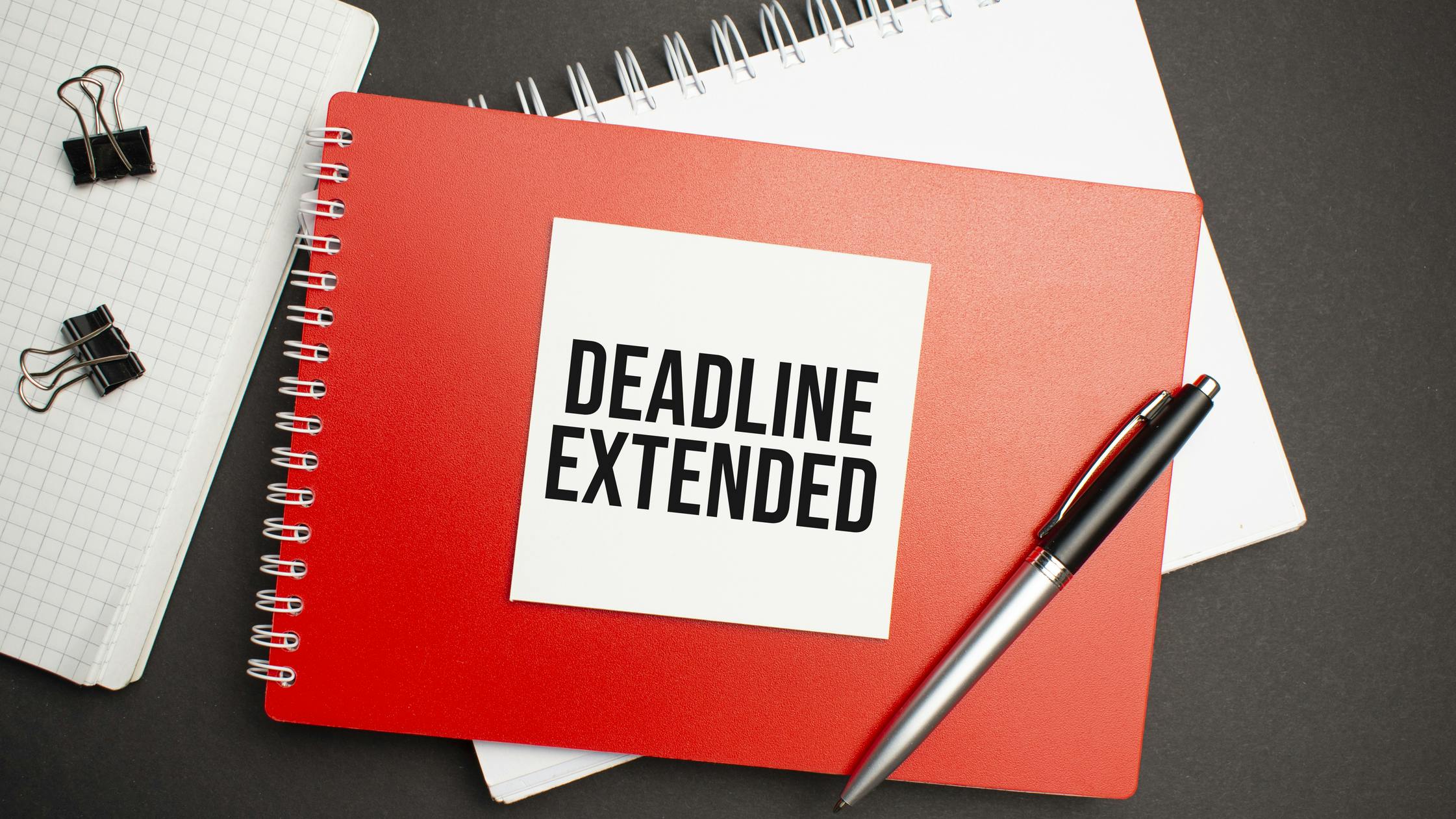 Deadline extension graphic with notebooks