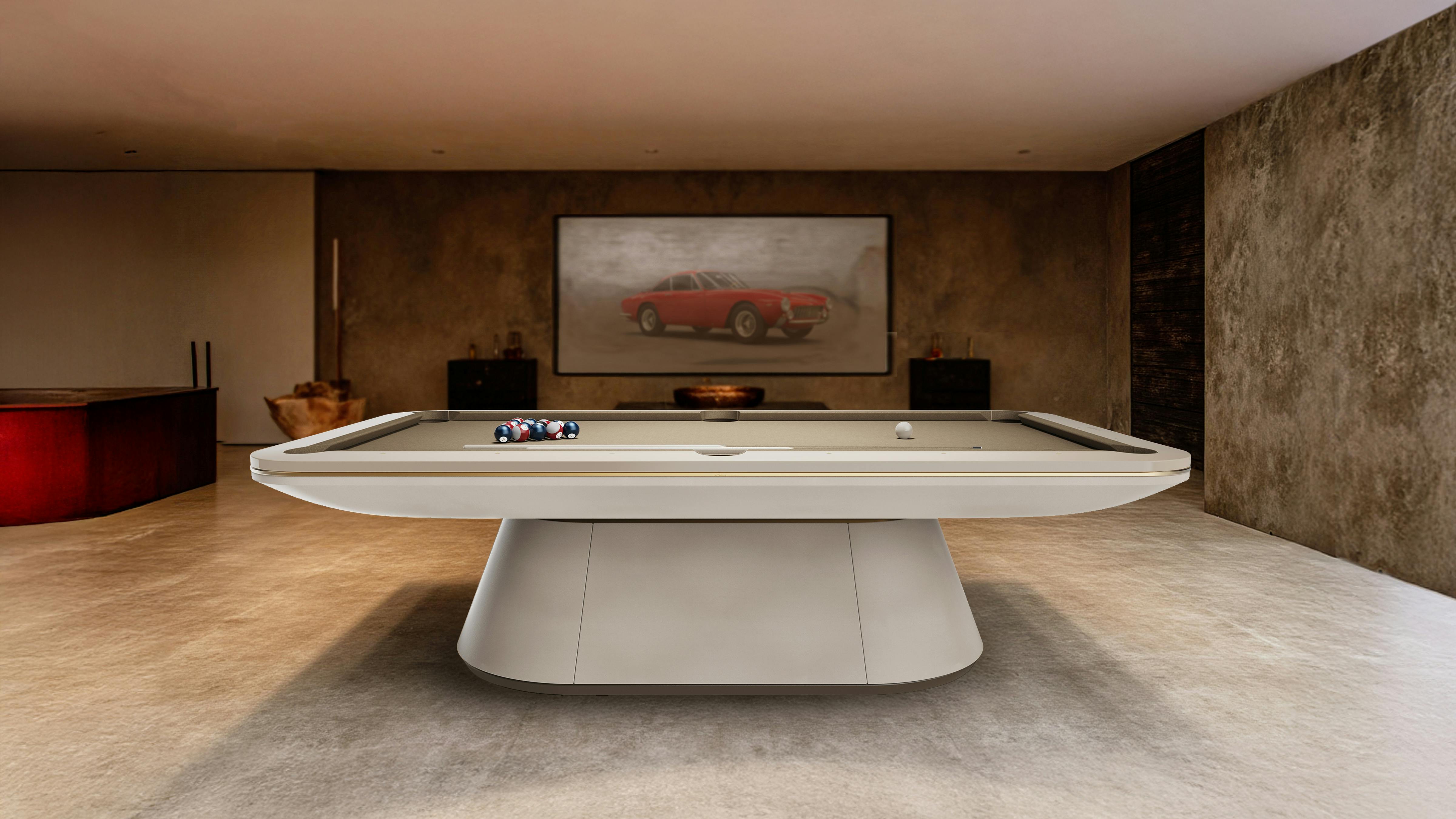 Sleek, contemporary billiard table in beige color tone in open room.