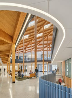 Extended view of I3R building atrium and staircase shows a central seating area and architectural details that lead occupants to the main staircase. Extended view of I3R building atrium and staircase shows a central seating area and architectural details that lead occupants to the main staircase.