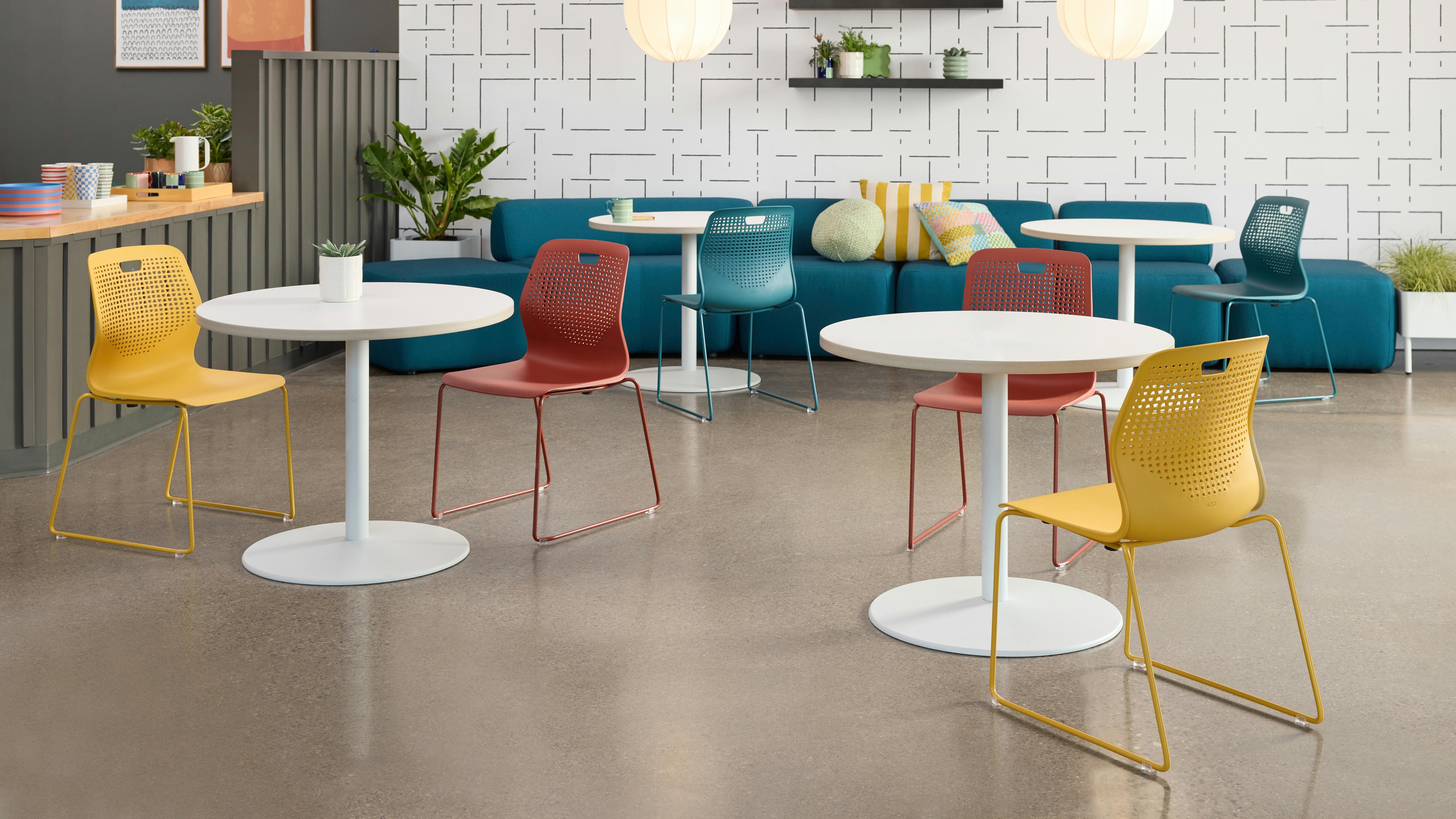 The Etch multi-purpose seating delivers stylish, adaptable seating that is durable. The chairs are arranged around tables in a collaborative space.