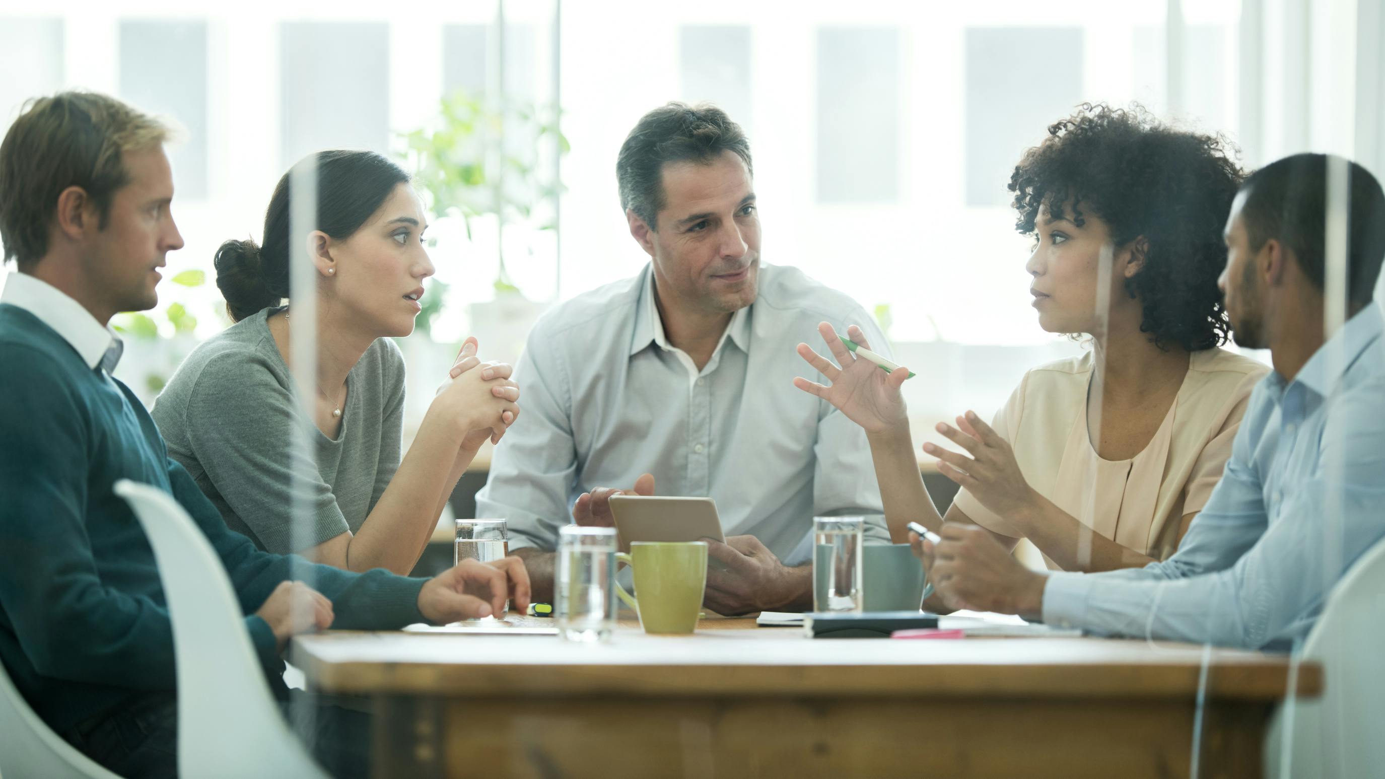 Team conducting business discussion in conference room