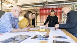 LPA Design Studios team looking over photos and renderings LPA Design Studios team looking over photos and renderings