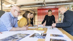 LPA Design Studios team looking over photos and renderings LPA Design Studios team looking over photos and renderings