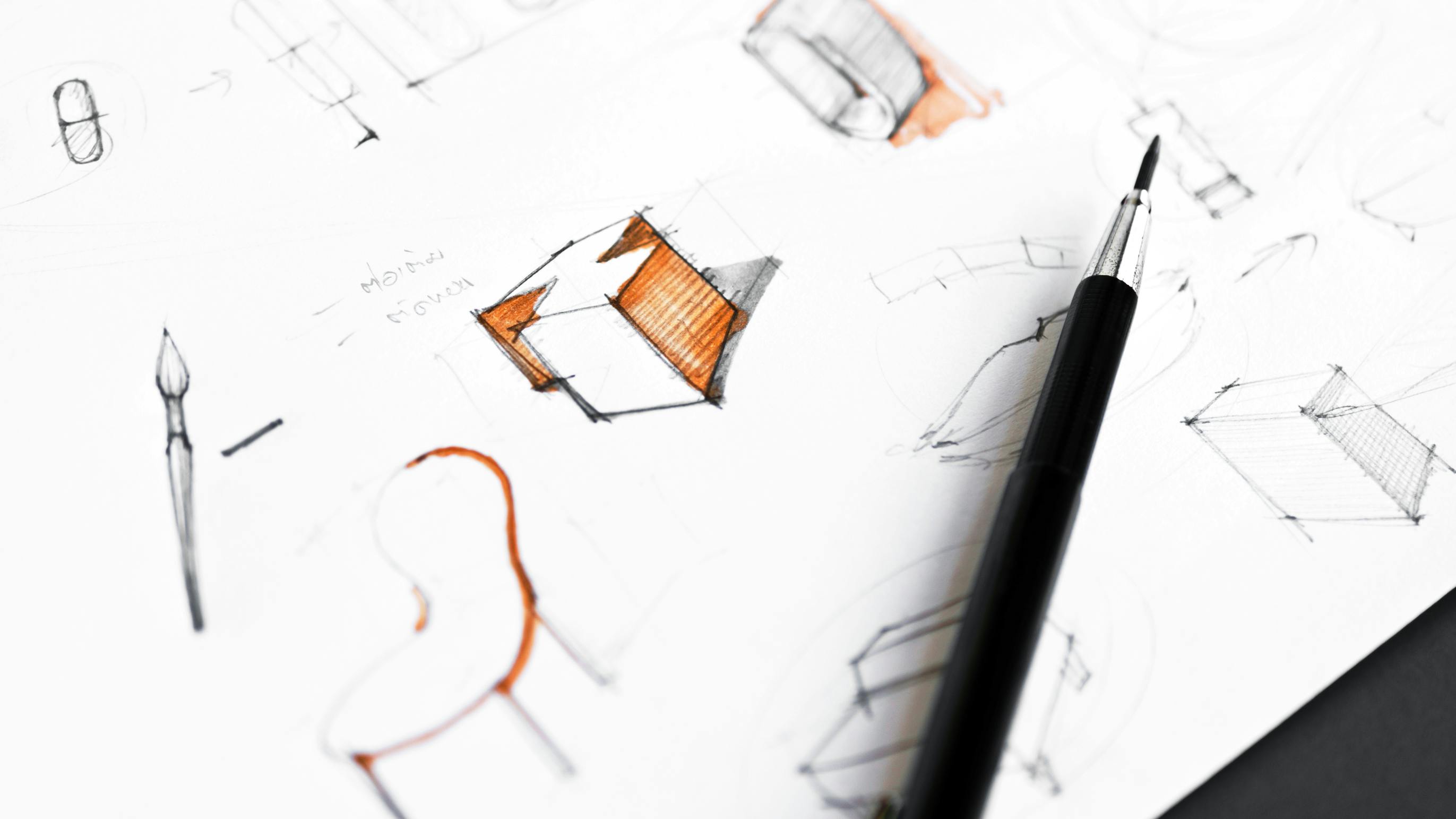 Idea concept sketching of product design on white paper.