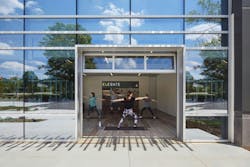 Open yoga space with students and instructor Open yoga space with students and instructor