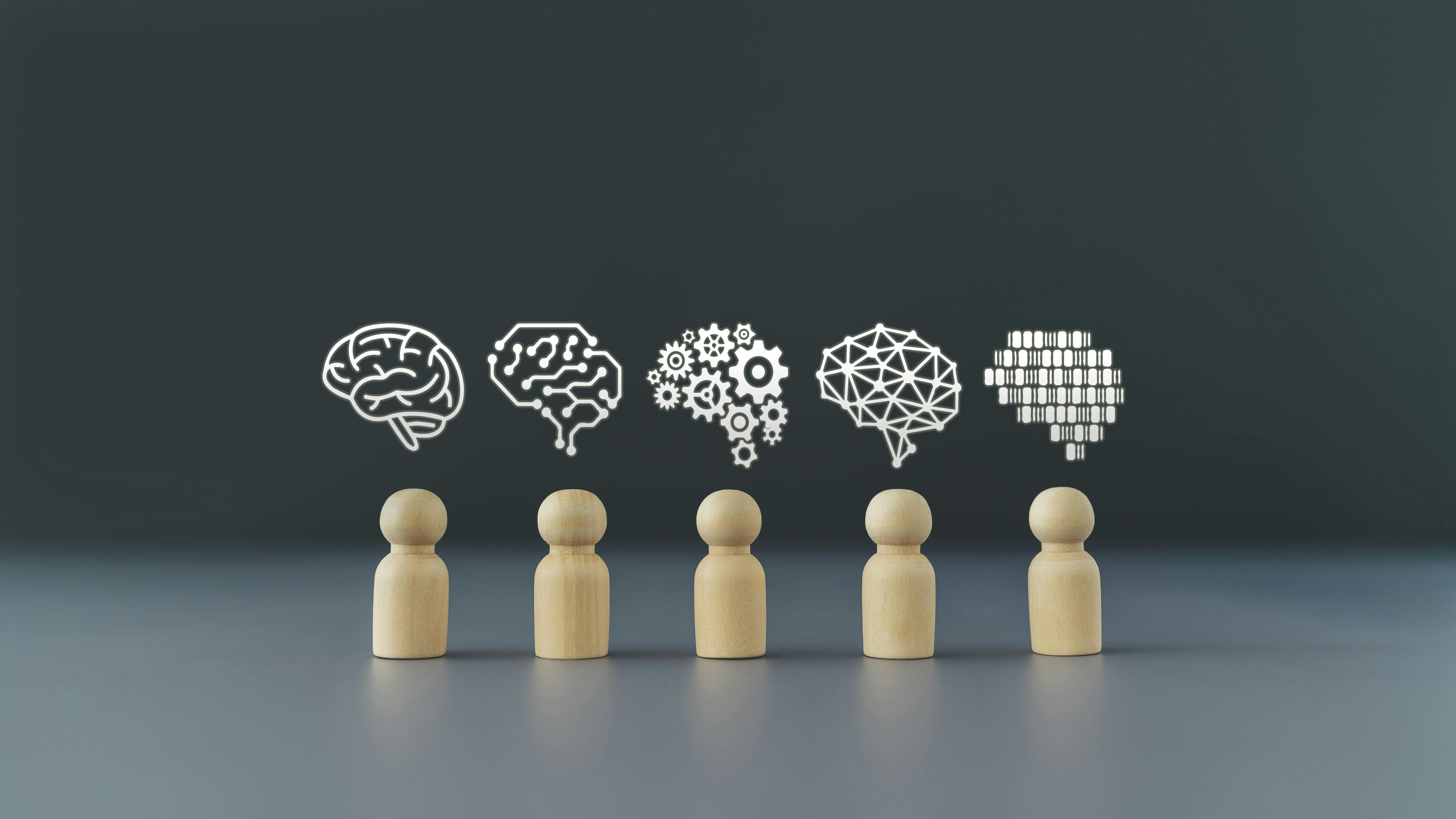 Light wood pawns in a row with different graphic representations of brains floating above them against gray background.
