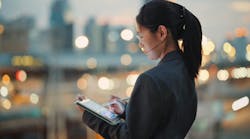 Businesswoman using tablet with artificial intelligence application Businesswoman using tablet with artificial intelligence application