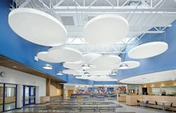 Acoustibuilt Seamless Acoustical Ceiling Clouds in white distinguish large-group seating areas against a sky-blue wall surround in the cafeteria at Saratoga Springs High School. Acoustibuilt Seamless Acoustical Ceiling Clouds in white distinguish large-group seating areas against a sky-blue wall surround in the cafeteria at Saratoga Springs High School.
