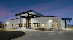 Big Horn Academy K–12 facility with white exterior cladding and clean lines, blending with the neighborhood aesthetic and honoring local Native American culture. Big Horn Academy K–12 facility with white exterior cladding and clean lines, blending with the neighborhood aesthetic and honoring local Native American culture.