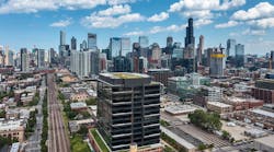 Daytime exterior view of the Fulton Labs building at 400 N Aberdeen in Chicago’s Fulton Market district, showing its glass curtainwall facade, dark metal mullions, adjacent city skyline, and urban street frontage. Daytime exterior view of the Fulton Labs building at 400 N Aberdeen in Chicago’s Fulton Market district, showing its glass curtainwall facade, dark metal mullions, adjacent city skyline, and urban street frontage.