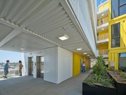 El Cerrito exterior view at elevators and community courtyard space El Cerrito exterior view at elevators and community courtyard space