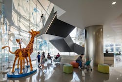 University Health Women's & Children's Hospital atrium with soft seating and chairs in cheerful colors and a whimsical giraffe sculpture. University Health Women's & Children's Hospital atrium with soft seating and chairs in cheerful colors and a whimsical giraffe sculpture.