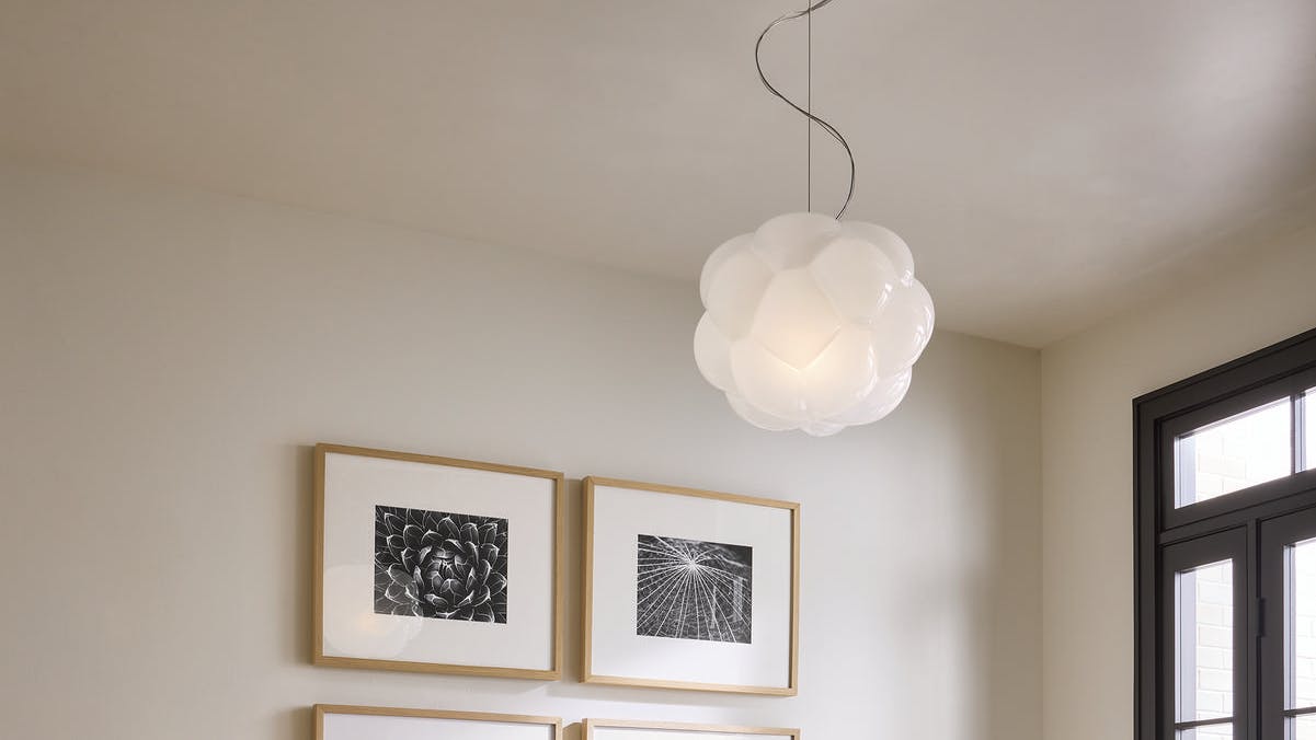 The Cloudy pendant features an ombre blend of white and clear glass on its shade.