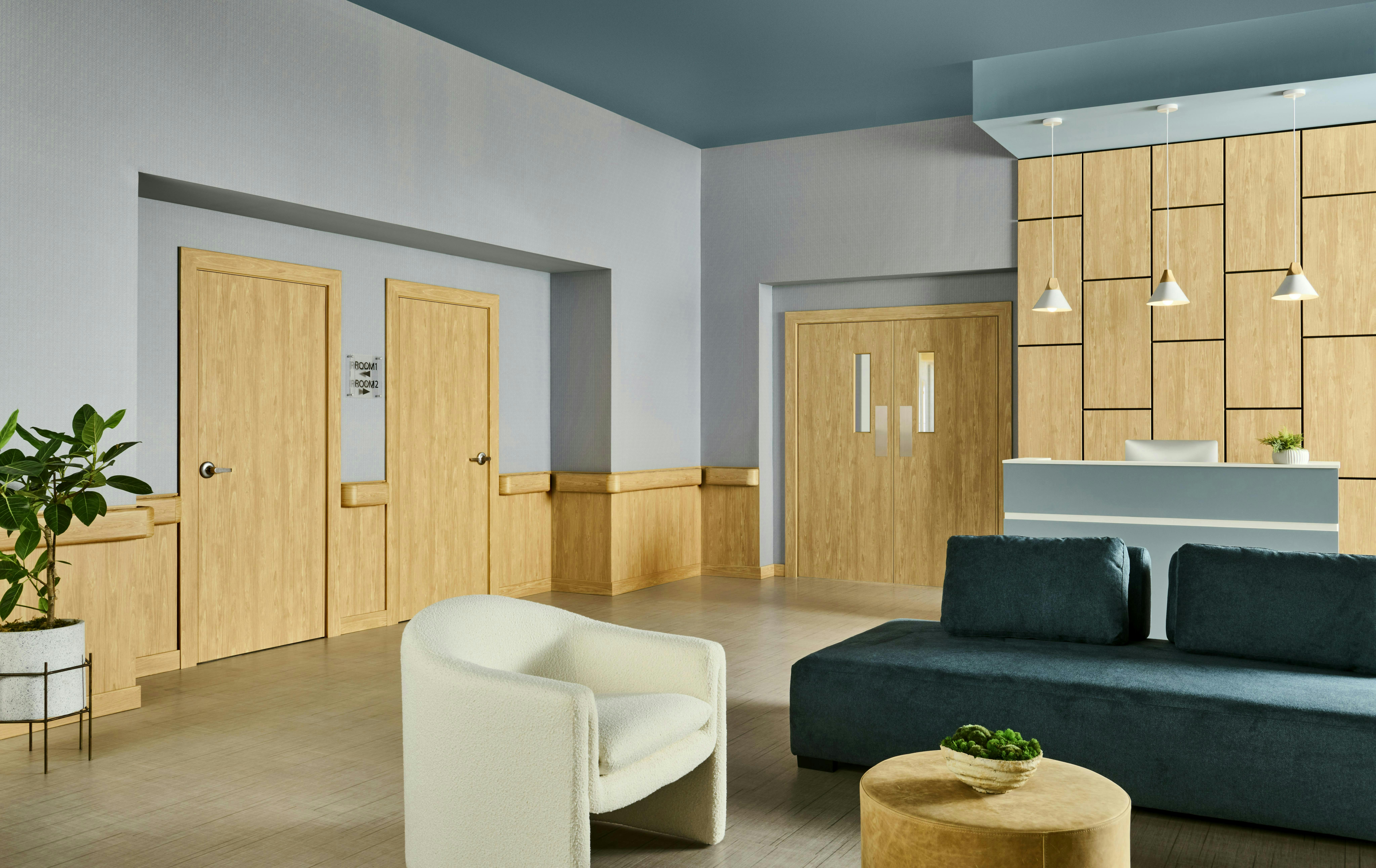 Rendering of an interior lounge area in a behavioral health treatment facility with modern, comfortable furnishings with rounded edges and soothing blue hues Rendering of an interior lounge area in a behavioral health treatment facility with modern, comfortable furnishings with rounded edges and soothing blue hues