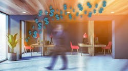 Office worker walking across contemporary commercial workspace, with overlay of teal dollar signs to indicate budget Office worker walking across contemporary commercial workspace, with overlay of teal dollar signs to indicate budget