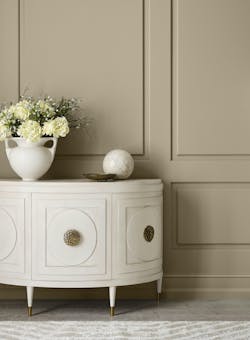 Sherwin-Williams 2026 Color of the Year is Universal Khaki, shown painted on a wall in front of a dresser. Sherwin-Williams 2026 Color of the Year is Universal Khaki, shown painted on a wall in front of a dresser.