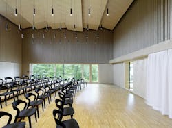 Hightower's Mixis Chair set up in rows within a large room. Hightower's Mixis Chair set up in rows within a large room.