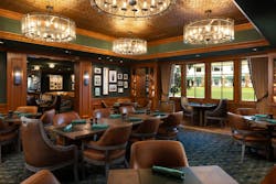 The Tap Room at The Lodge at Pebble Beach featuring warm wood and leather furnishings, green accents, and gallery walls celebrating golf history. The Tap Room at The Lodge at Pebble Beach featuring warm wood and leather furnishings, green accents, and gallery walls celebrating golf history.