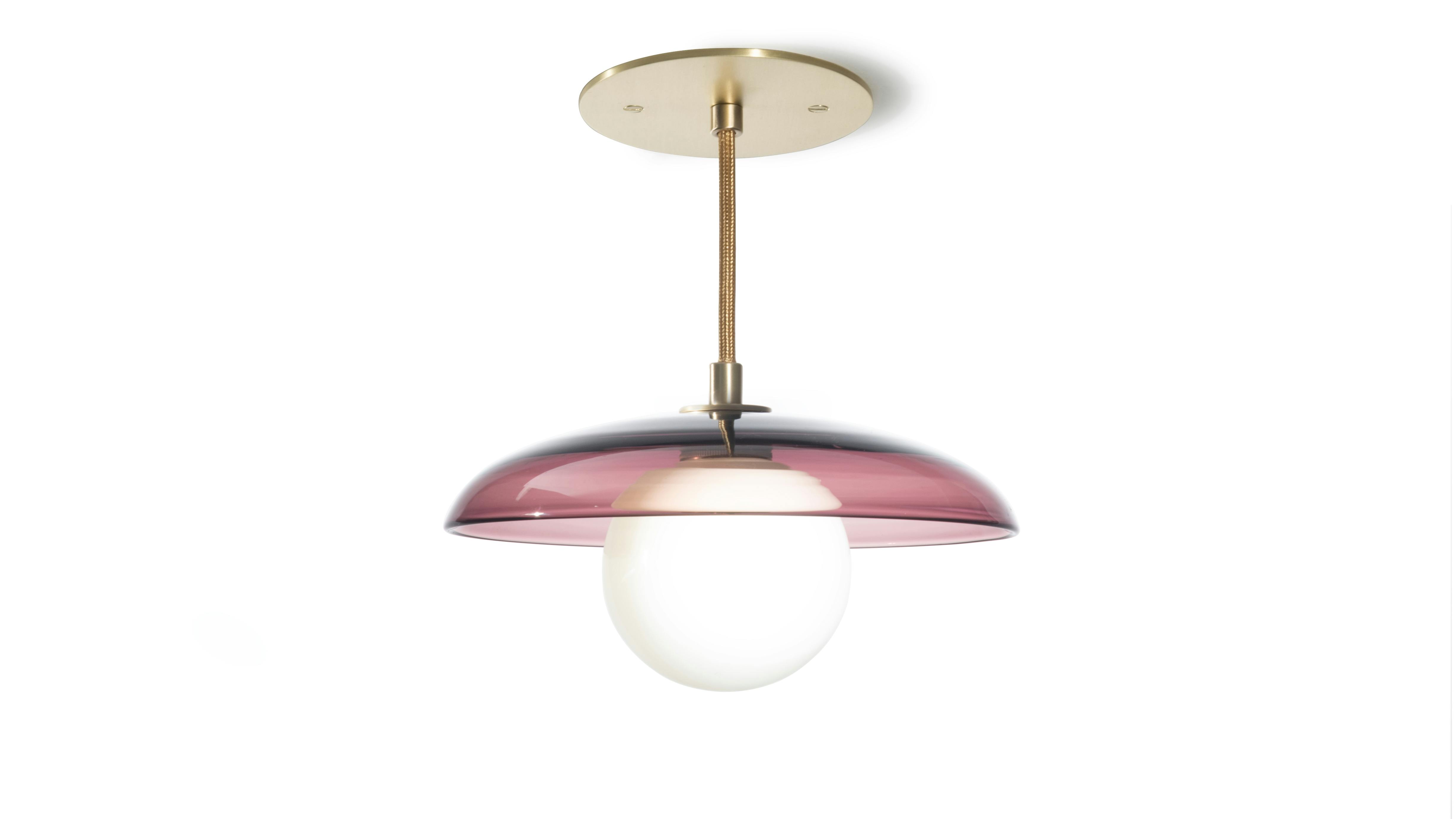 The Concavo Pendant comes in four diameters and 29 colors. The pendant is shown in plum, perfect for spreading a little love.