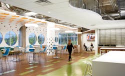 A workplace café and shared gathering space designed to support teamwork and flexibility maintains color and material palette continuity. A workplace café and shared gathering space designed to support teamwork and flexibility maintains color and material palette continuity.